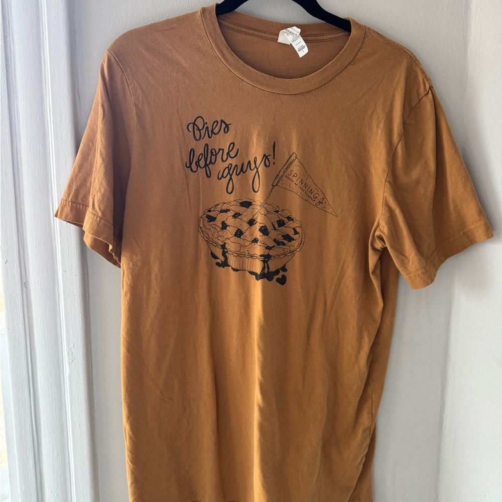 Spinning J’s bakery “Pies before guys!” short sleeve tee, Bella Canvas, Rust, L
